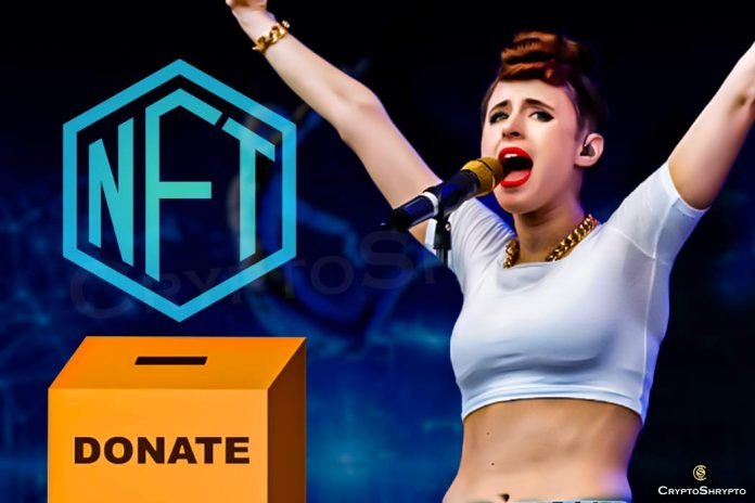 Kiesza supports the NFT robot, which will provide prosthetic limbs to a young man and a dog